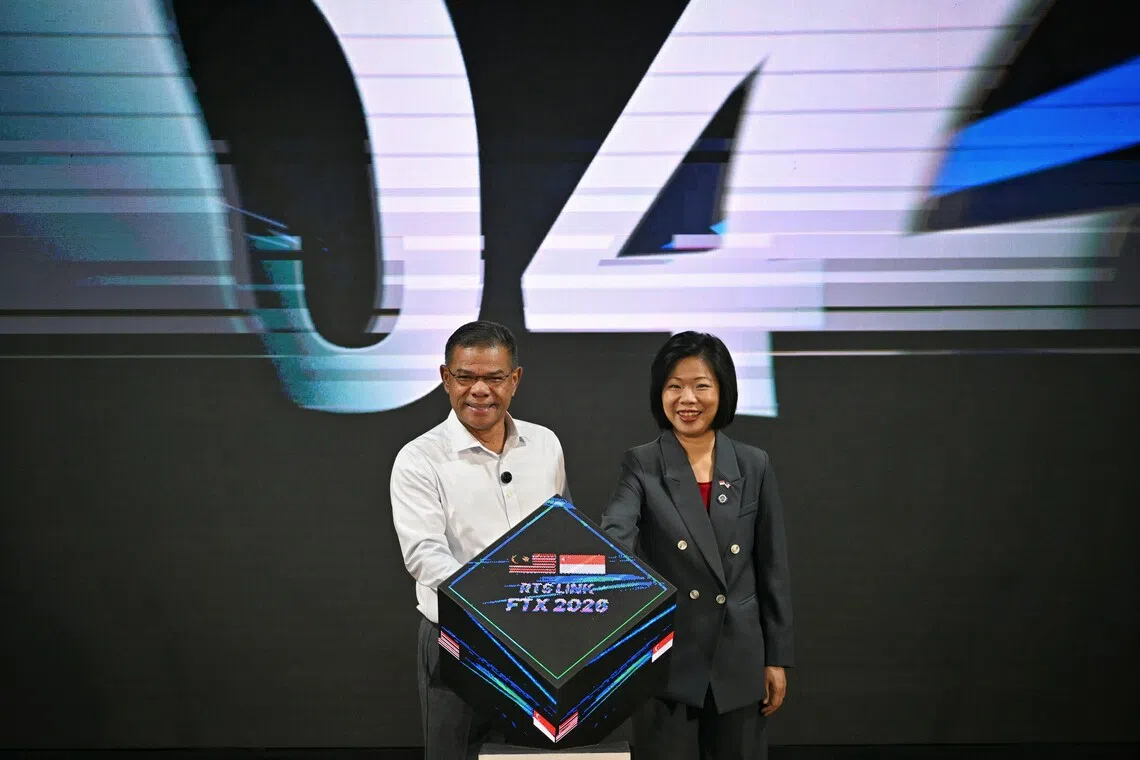 Malaysian Home Minister Saifuddin Nasution Ismail and Singapore’s Second Minister for Home Affairs Sim Ann at a closing ceremony for the cross-border field training exercise on Oct 28.