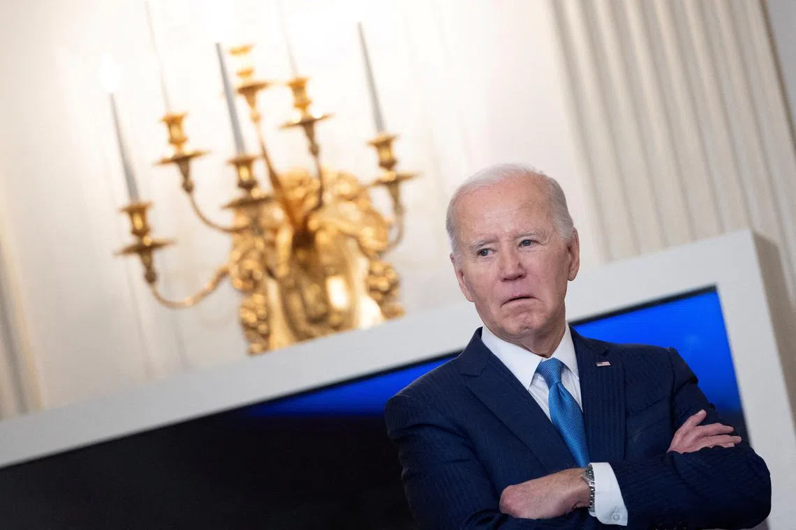 FILE PHOTO: U.S. President Joe Biden looks on before speaking during a roundtable discussion on public safety at the State Dining Room at the White House in Washington, U.S., February 28, 2024. REUTERS/Tom Brenner/File Photo