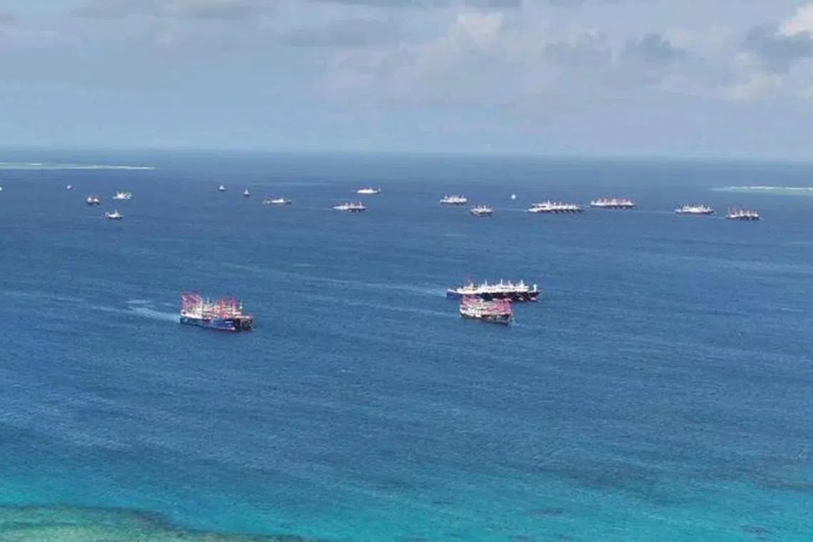 FILE PHOTO: Chinese militia vessels operate at Whitsun Reef in the South China Sea, December 2, 2023. Philippine Coast Guard/Handout via REUTERS. FILE PHOTO