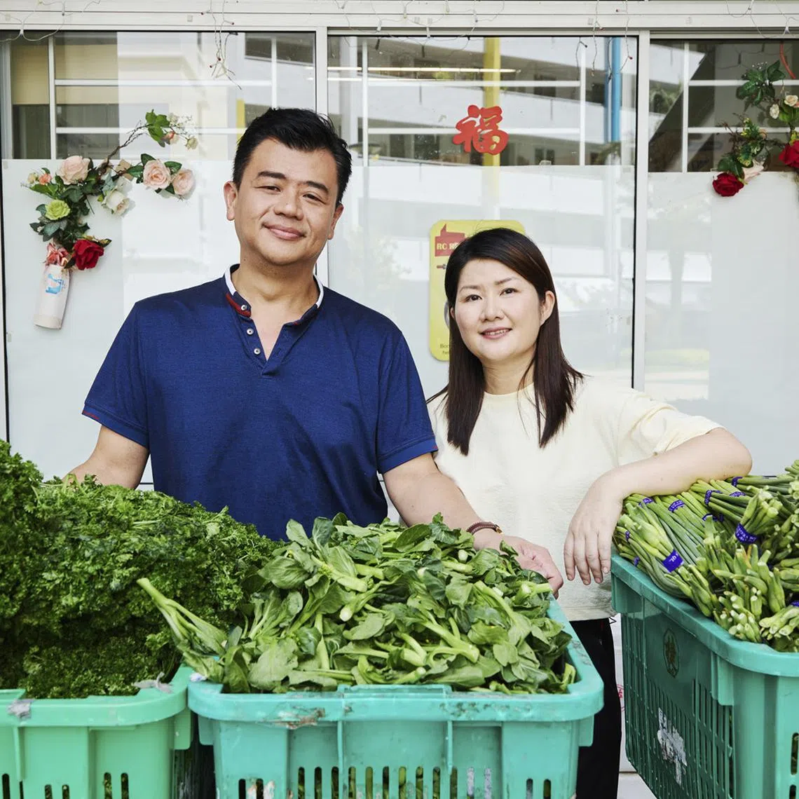 Married couple Ong Pang Yaw and Annie Pan co-ordinate a weekly vegetable distribution programme at Ping An Green Residents Committee in Kampong Chai Chee. PHOTO: SPH MEDIA
