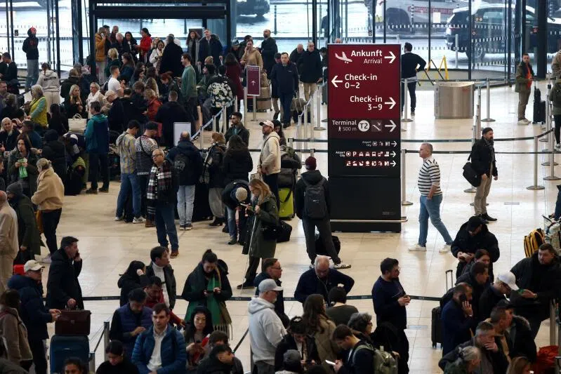 Passengers wait at the Berlin Brandenburg Airport in Germany, on Feb 6, 2026.