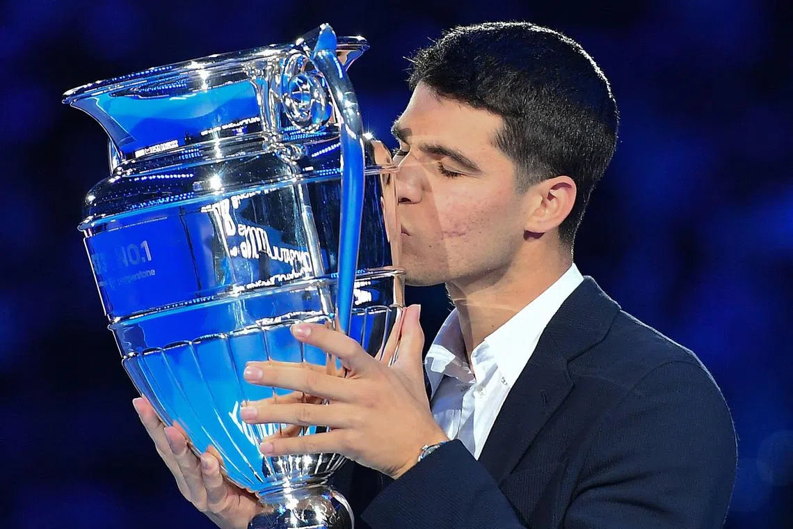 Carlos Alcaraz receives the trophy for finishing the ATP's year ranking on first place, in Italy on Nov 16, 2022.