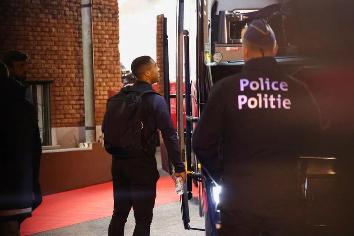 A member of Belgium soccer team boards a bus at King Baudouin Stadium after play was suspended after a shooting in Brussels, Belgium, October 17, 2023 REUTERS/Yves Herman
