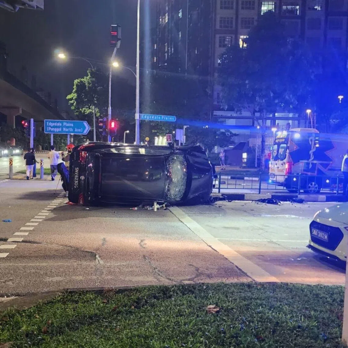 The Straits Times saw a black car flipped on its side at the junction. The road divider was damaged and a traffic light pole was seen on the ground.