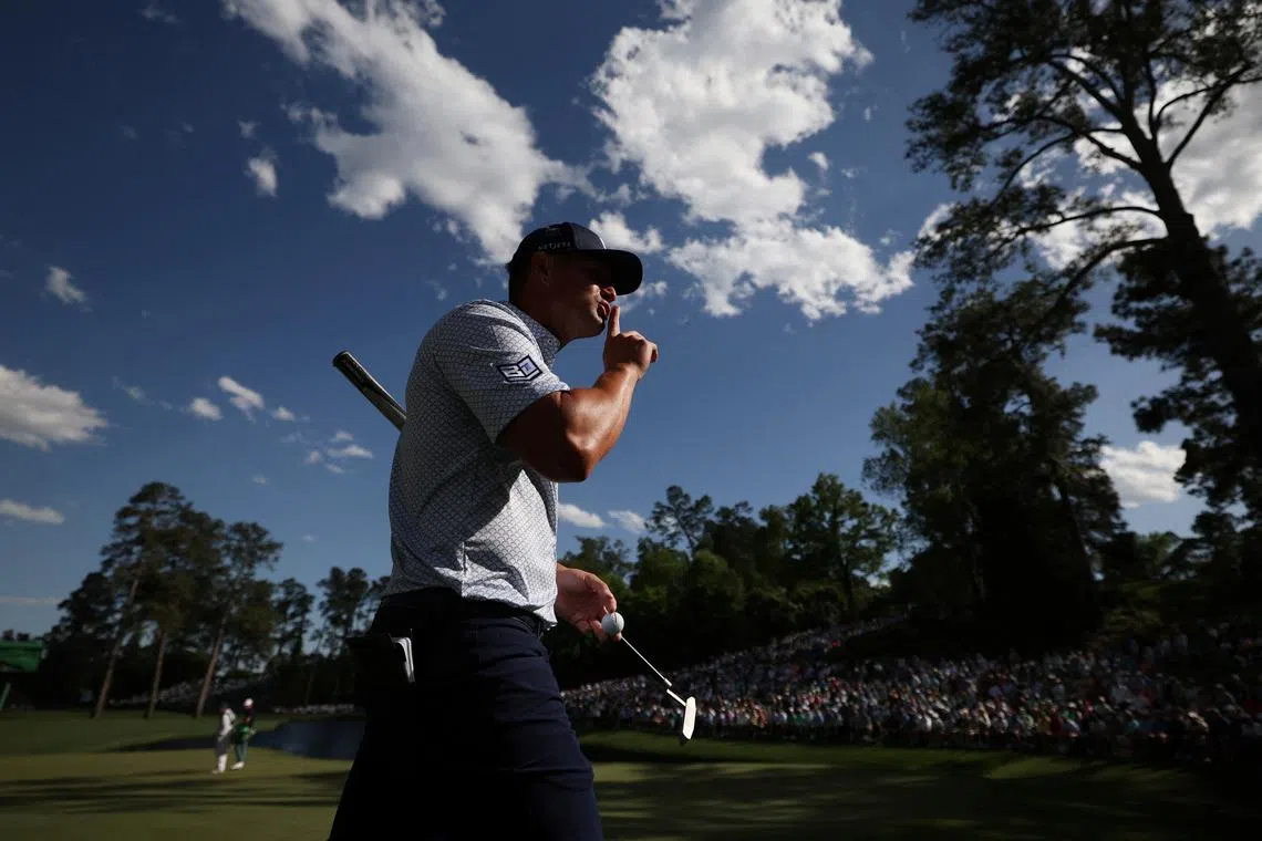 Golf - The Masters - Augusta National Golf Club, Augusta, Georgia, U.S. - April 12, 2024 Bryson DeChambeau of the U.S. gestures to the crowd on the 16th hole during the second round REUTERS/Eloisa Lopez