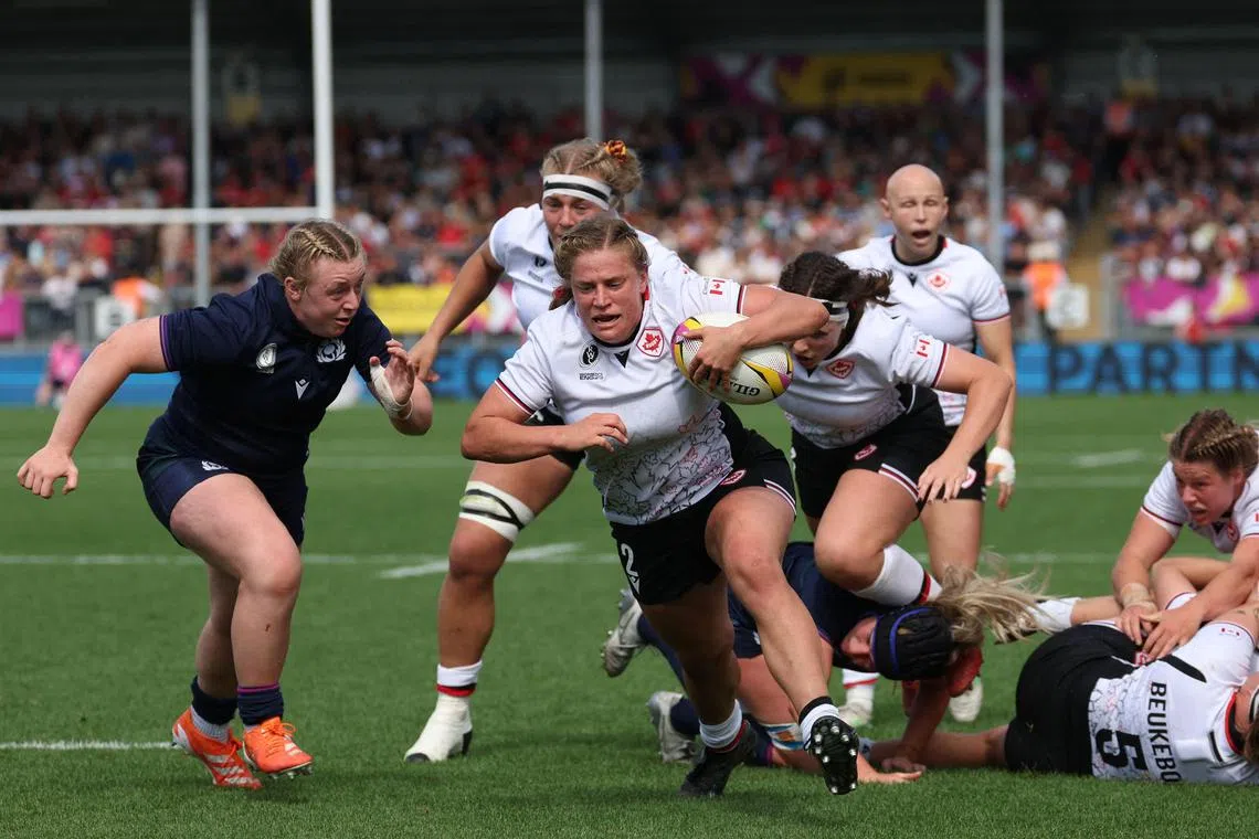 Canada's hooker Emily Tuttosi runs to the line to score one of her two tries in the Women’s Rugby World Cup pool B match against Scotland at Sandy Park, Exeter on Sept 6, 2025.