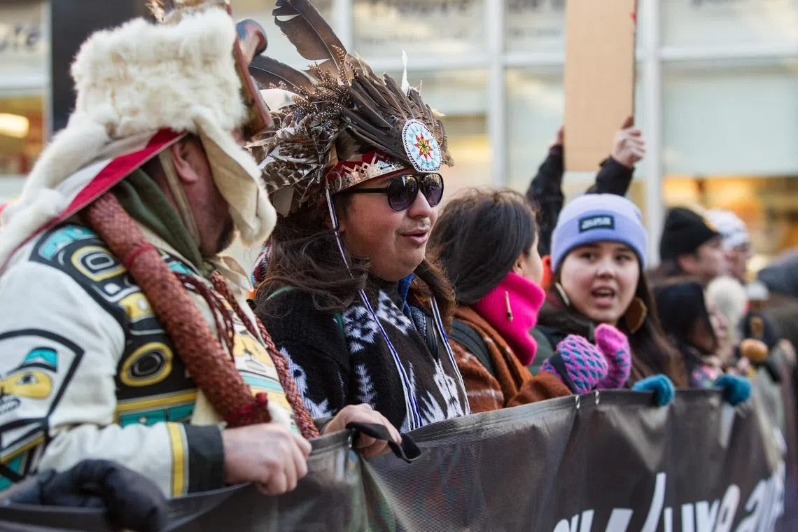Members of the indigenous community during the March for Biodiversity for Human Rights during the COP15 talks in Montreal,Canada on December 10, 2022.  (Photo by Alexis Aubin / AFP)
