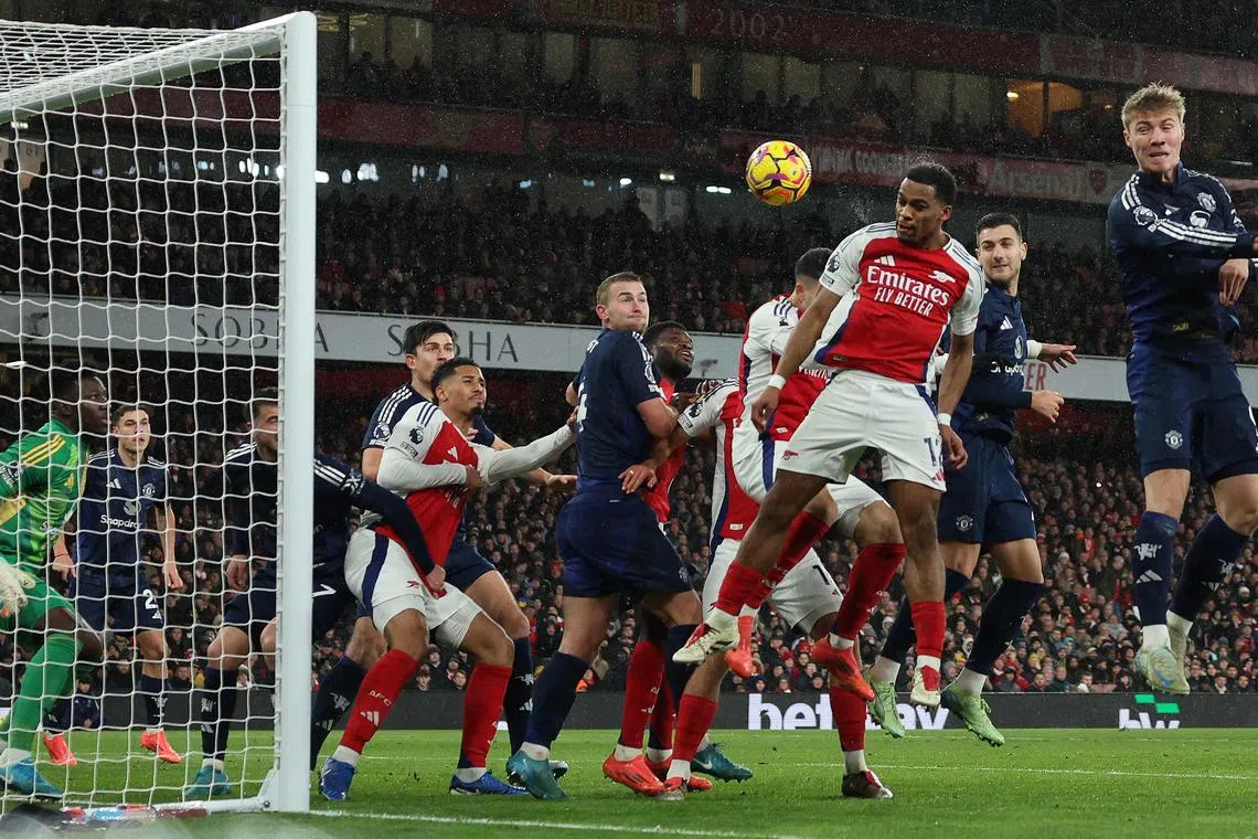 Arsenal's Jurrien Timber scoring from a corner in the 2-0 Premier League win over Manchester United.