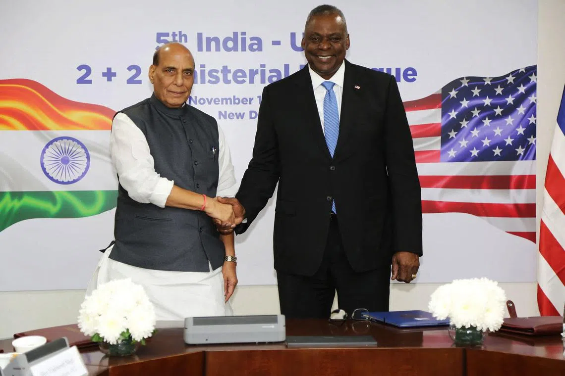 This handout photo taken and released on November 10, 2023, by the Indian Press Information Bureau (PIB) shows India's Defence Minister Rajnath Singh (L) shakes hands with US Secretary of Defence Lloyd Austin during their bilateral meeting in New Delhi. (Photo by PIB / AFP) / RESTRICTED TO EDITORIAL USE - MANDATORY CREDIT "AFP PHOTO /  INDIAN PRESS INFORMATION BUREAU (PIB) " - NO MARKETING NO ADVERTISING CAMPAIGNS - DISTRIBUTED AS A SERVICE TO CLIENTS
