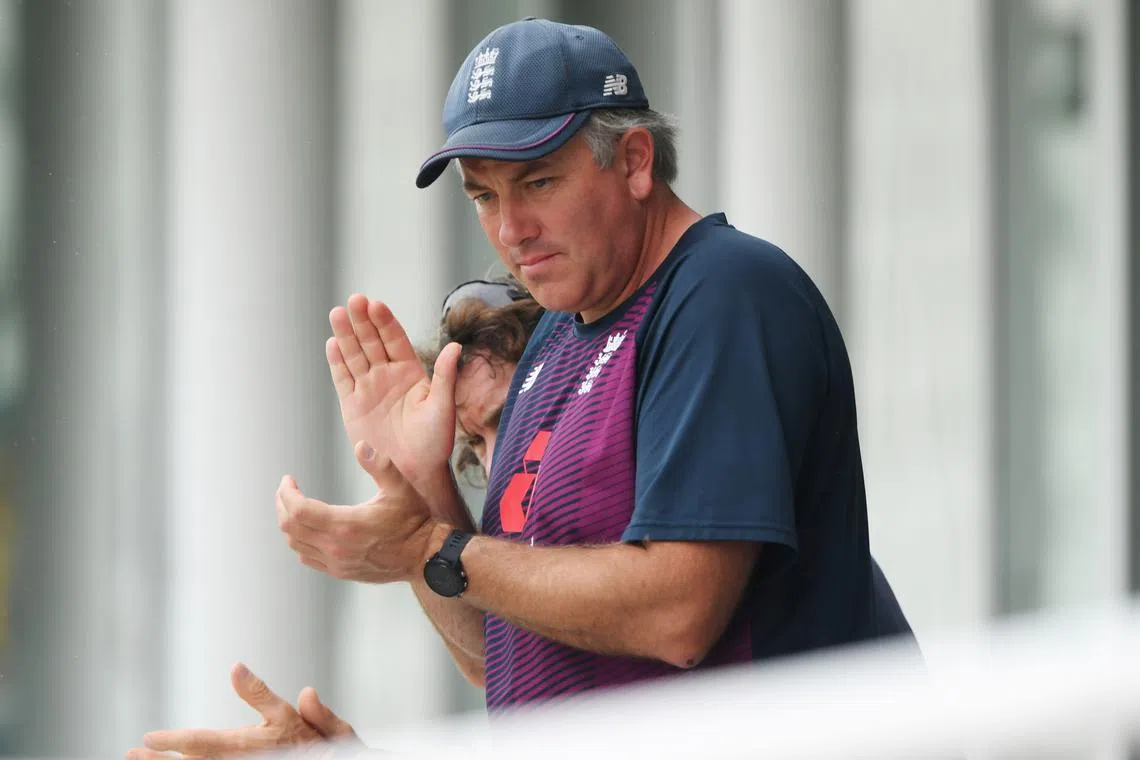 FILE PHOTO: Cricket - Second Test - England v Pakistan - Ageas Bowl, Southampton, Britain - August 13, 2020  England head coach Chris Silverwood applauds as the players walk off as rain delays play, as play resumes behind closed doors following the outbreak of the coronavirus disease (COVID-19)  Stu Forster/Pool via REUTERS