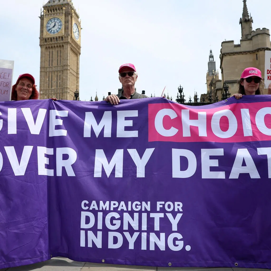 Supporters of the assisted dying law for terminally ill people hold a banner, on the day British lawmakers are preparing to vote on the bill, in London, Britain, June 20, 2025. REUTERS/Isabel Infantes