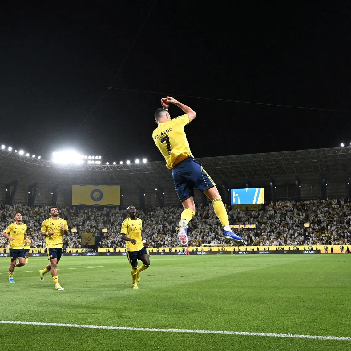 Soccer Football - Saudi Pro League - Al Nassr v Al Najmah - Al Awwal Park, Riyadh, Saudi Arabia - April 3, 2026 Al Nassr's Cristiano Ronaldo celebrates scoring their third goal with teammates REUTERS/Stringer