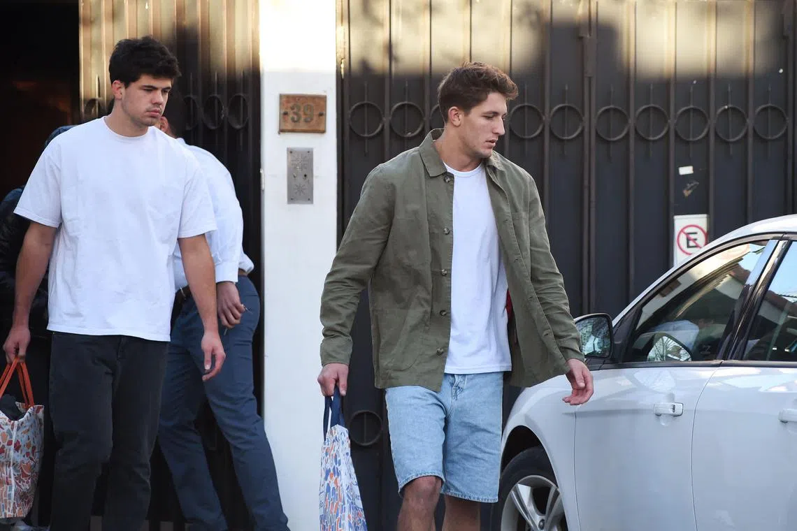 France rugby players Hugo Auradou (left) and Oscar Jegou leaving the house in which they served house arrest in Mendoza, Argentina. The duo was charged with aggravated rape in July while on tour with the team.
