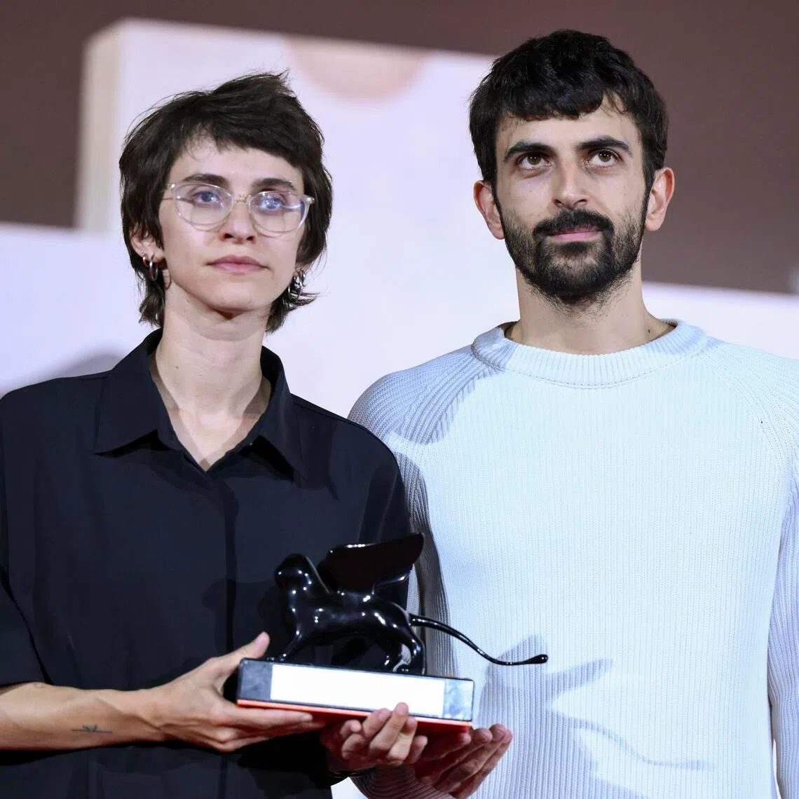 Israeli directors Rachel Szor (left) and Yuval Abraham holding the Special Jury Prize for their film NAZA at Venice International Film Festival on Sept 12.