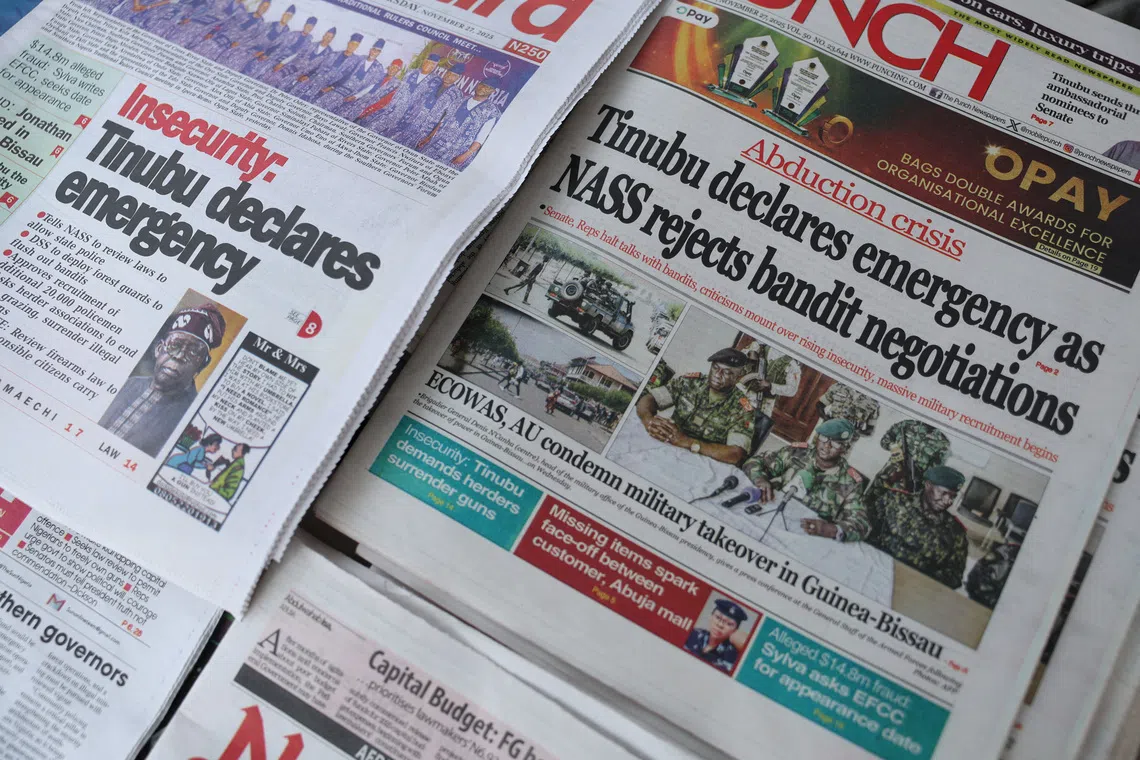 Front pages featuring headlines are displayed at a newspaper stall in Lagos, Nigeria, November 27, 2025. REUTERS/Sodiq Adelakun