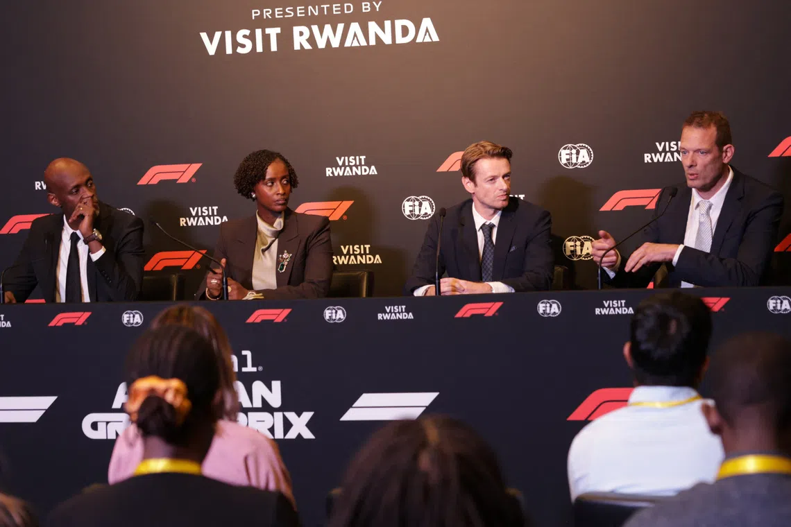 Formula One F1 - Formula One Press Conference - BK Arena - Kigali, Rwanda - October 13, 2026 Jean-Guy Afrika, CEO of the Rwanda Development Board, Nelly Mukayzayire, Minister of Sport of Rwanda, Carsten Tilke, Managing Director of Tilke GmbH & Co. KG and Former F1 driver Alex Wurz during the press conference after Formula 1 officially announced a 10-year agreement to host the African Grand Prix in Rwanda, marking the sport's first return to the African continent since 1993 REUTERS/Jean Bizimana
