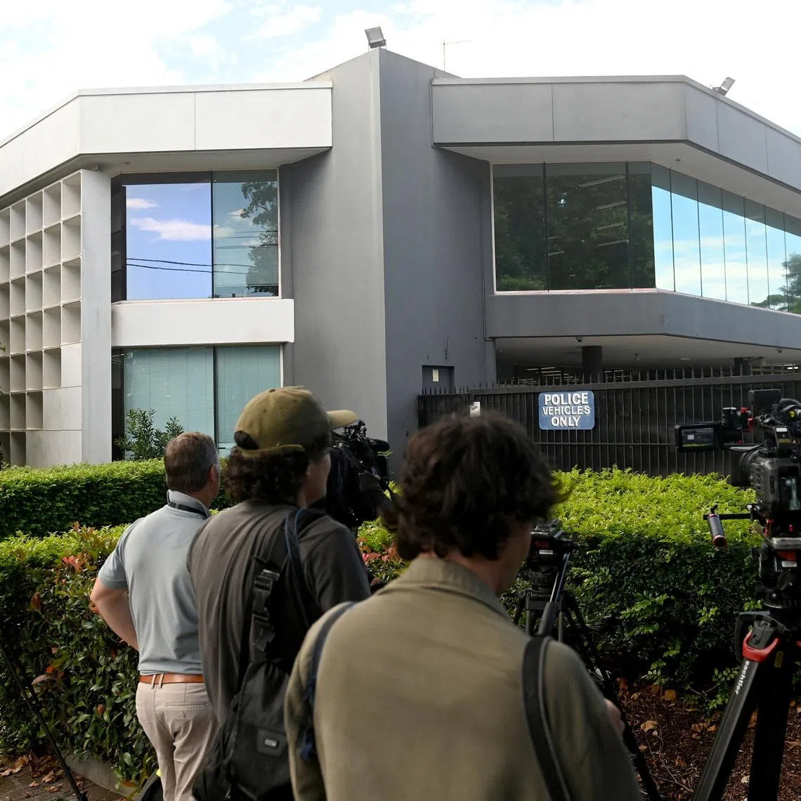 Members of the media wait outside Mascot Police Station after former SAS soldier Ben Roberts-Smith was charged with alleged war crimes committed in Afghanistan, in Sydney, Australia, April 7, 2026. REUTERS/Jeremy Piper