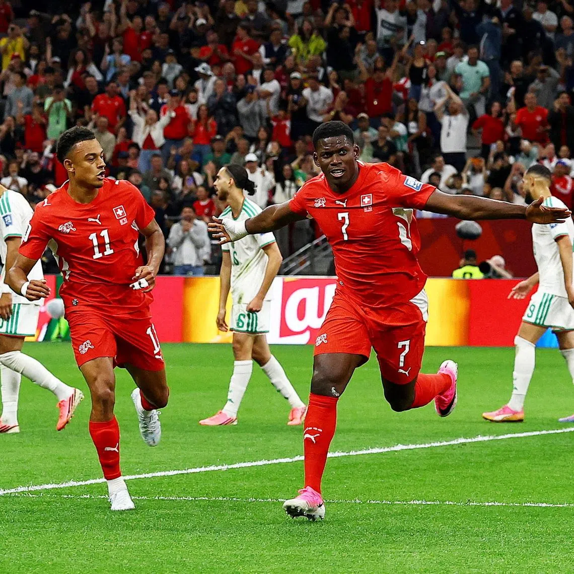 Switzerland’s Breel Embolo celebrates scoring their first goal.