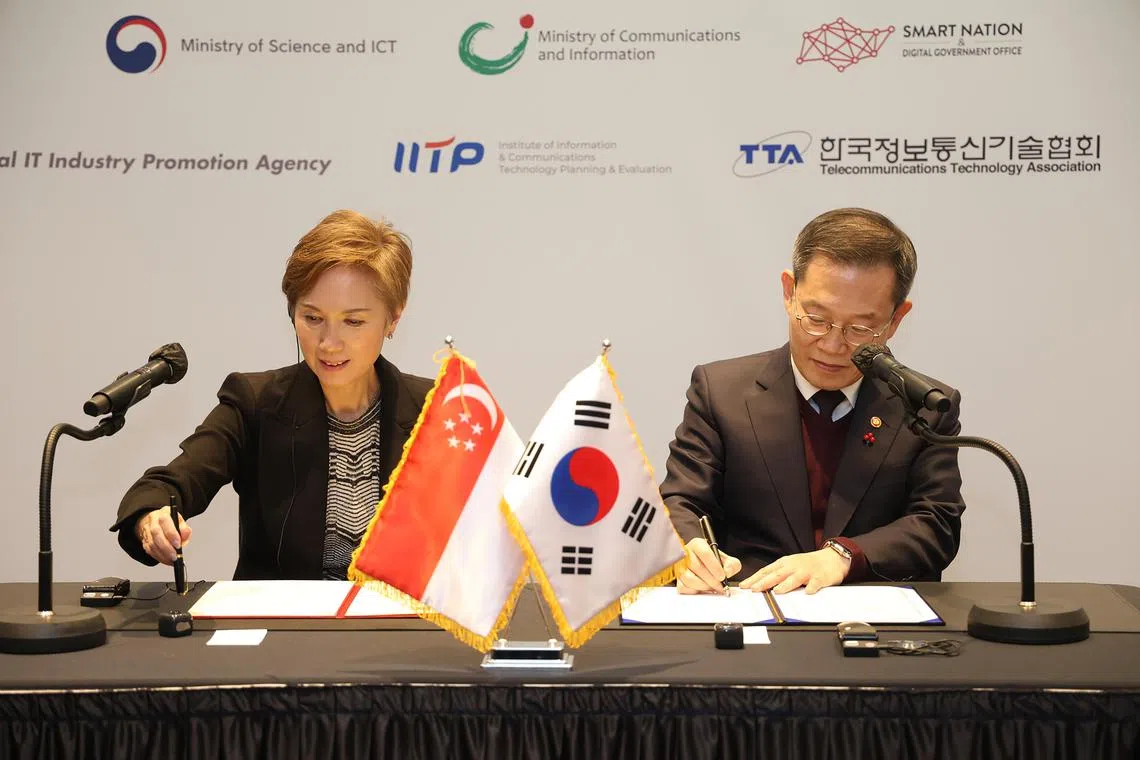 Singapore's Minister for Communications and Information Josephine Teo and South Korea's Minister of Science and ICT Lee Jong-ho signing a Memorandum of Understanding on collaborating in artificial intelligence in Seoul on Dec 6, 2022.
