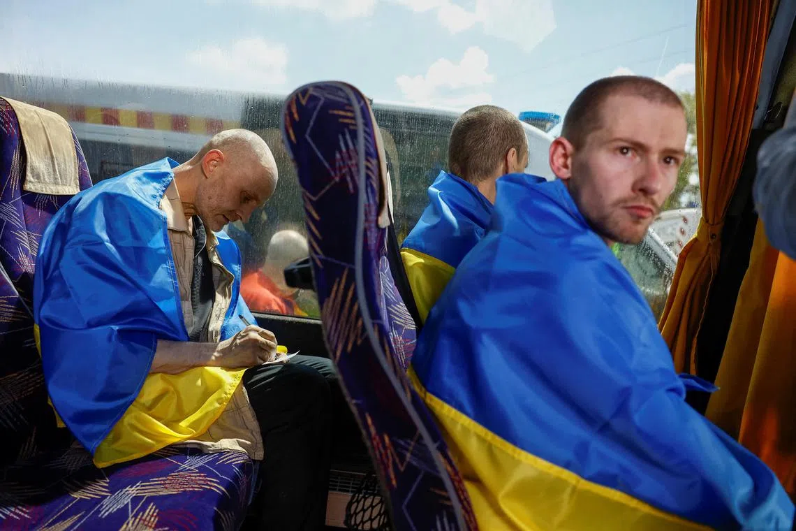 Ukrainian prisoners of war returning home during an earlier swop, in May 2024.