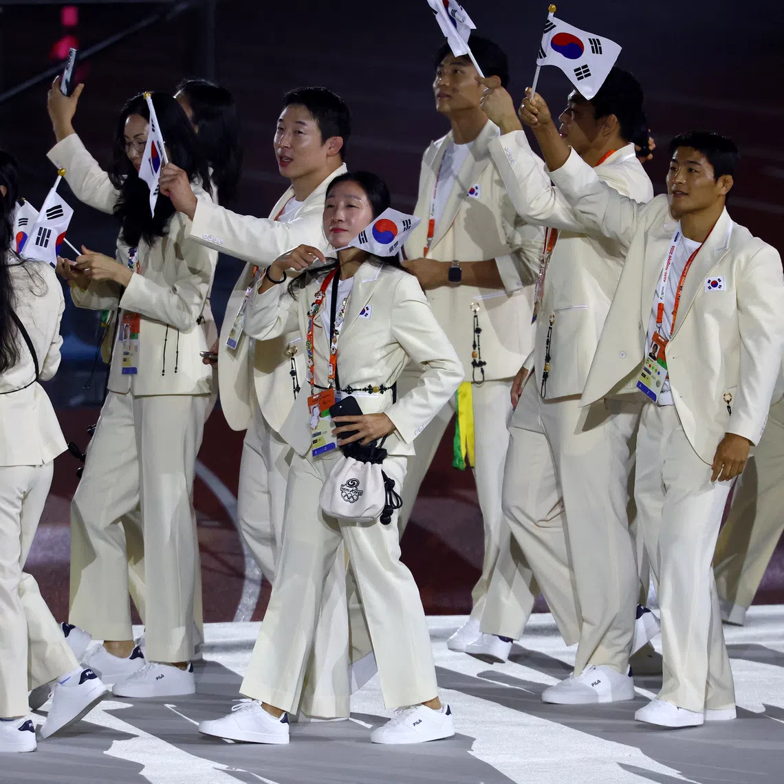 South Korean athletes at the closing ceremony of the Asian Games on Oct 4. There was public backlash after footballers celebrated military exemptions for winning gold at the Games.