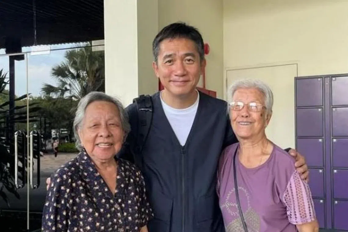 Hong Kong star Tony Leung Chiu Wai posing with two elderly women for a photo at Gardens by the Bay in early February.