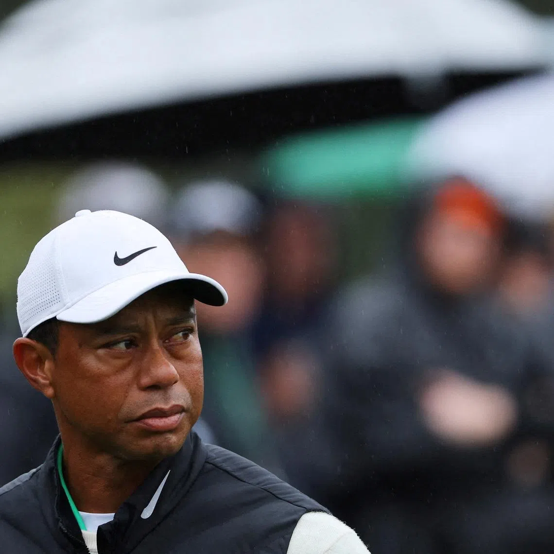 FILE PHOTO: Golf - The Masters - Augusta National Golf Club - Augusta, Georgia, U.S. - April 8, 2023 Tiger Woods of the U.S. reacts after holing his bogey putt on the 17th green during the second round REUTERS/Mike Blake/File Photo