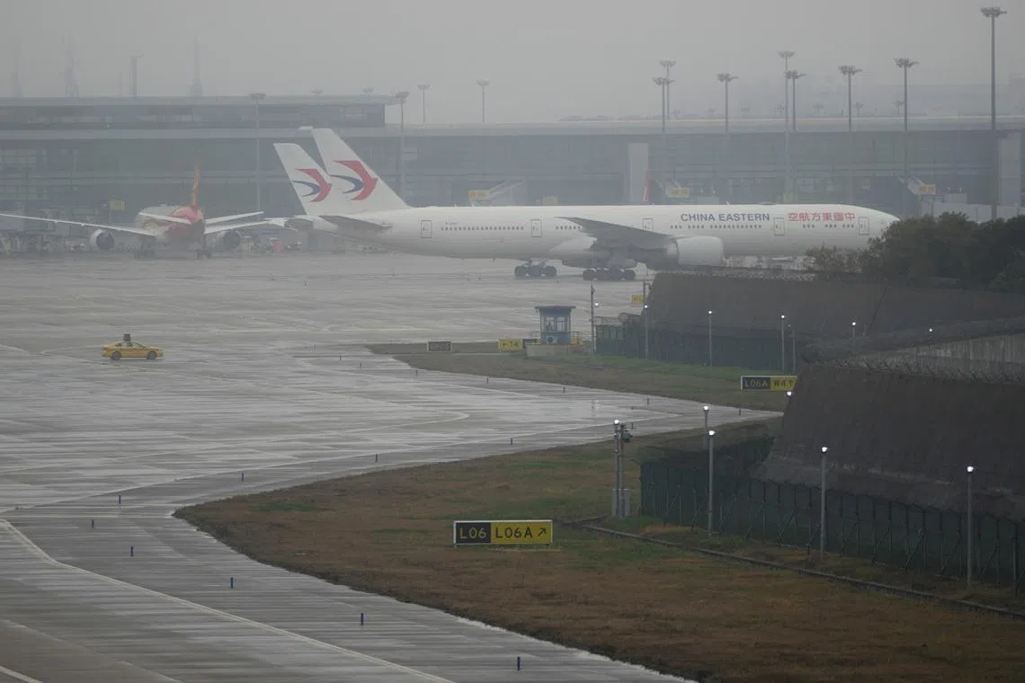 China Eastern Airlines aircrafts are parked at Pudong International Airport in Shanghai, China, March 21, 2023. REUTERS/Aly Song
