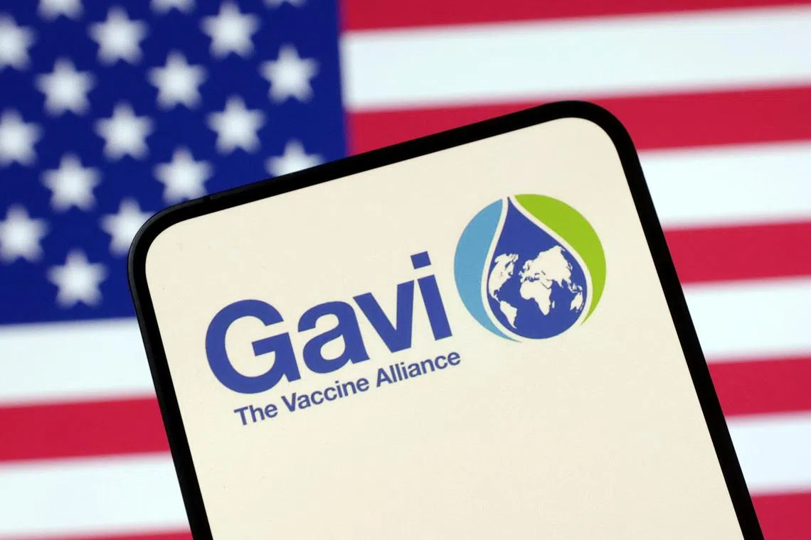 The Vaccine Alliance (GAVI) logo and U.S. flag are seen in this illustration taken April 23, 2025. REUTERS/Dado Ruvic/Illustration