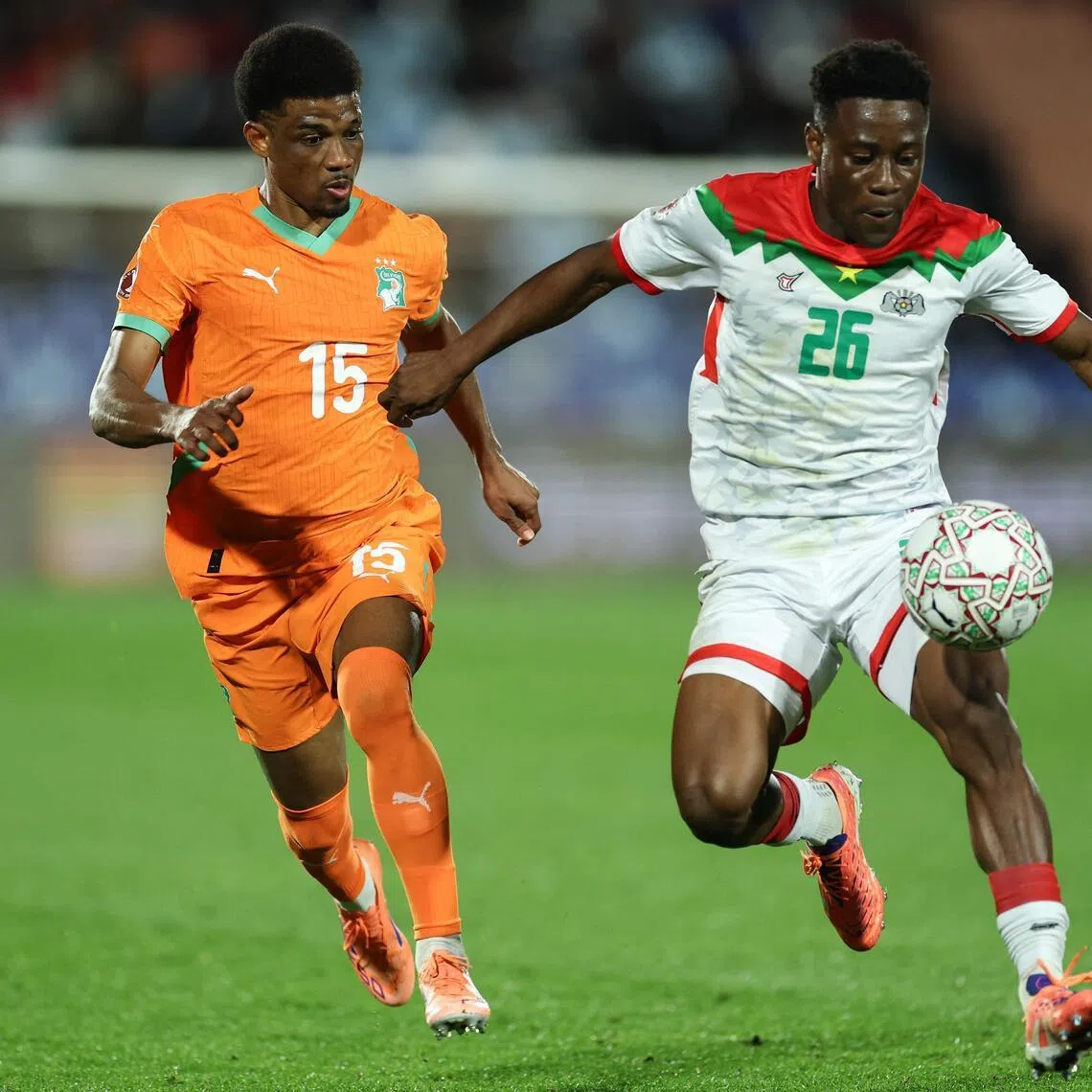 Ivory Coast forward Amad Diallo closing down Burkina Faso defender Arsene Kouassi in their Africa Cup of Nations round-of-16 football match at the Grand Stadium in Marrakesh on Jan 6, 2026.