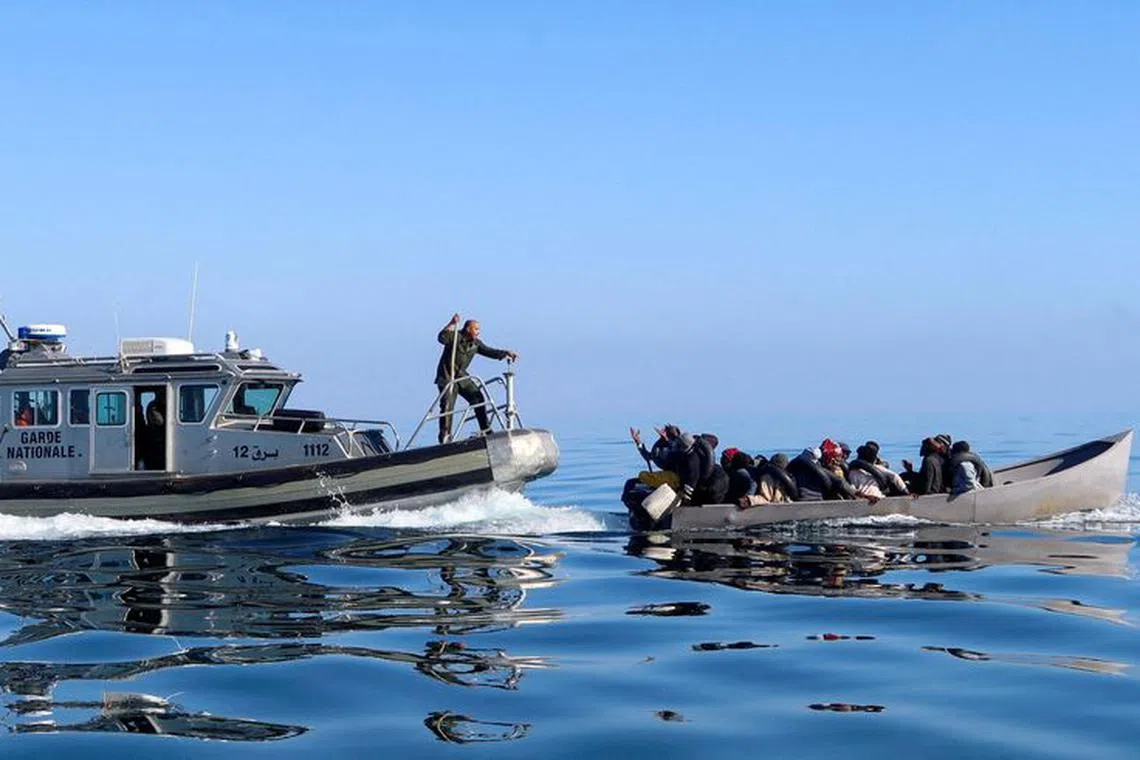FILE PHOTO: Tunisian coast guards try to stop migrants at sea during their attempt to cross to Italy, off the coast off Sfax, Tunisia April 27, 2023. REUTERS/Jihed Abidellaoui/File Photo