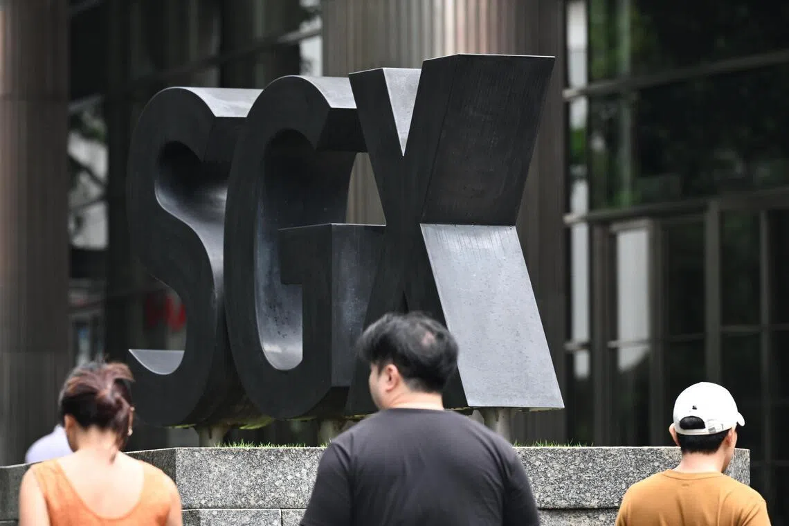 The benchmark Straits Times Index (STI) gained 21.41 points to finish at 4,965.50..