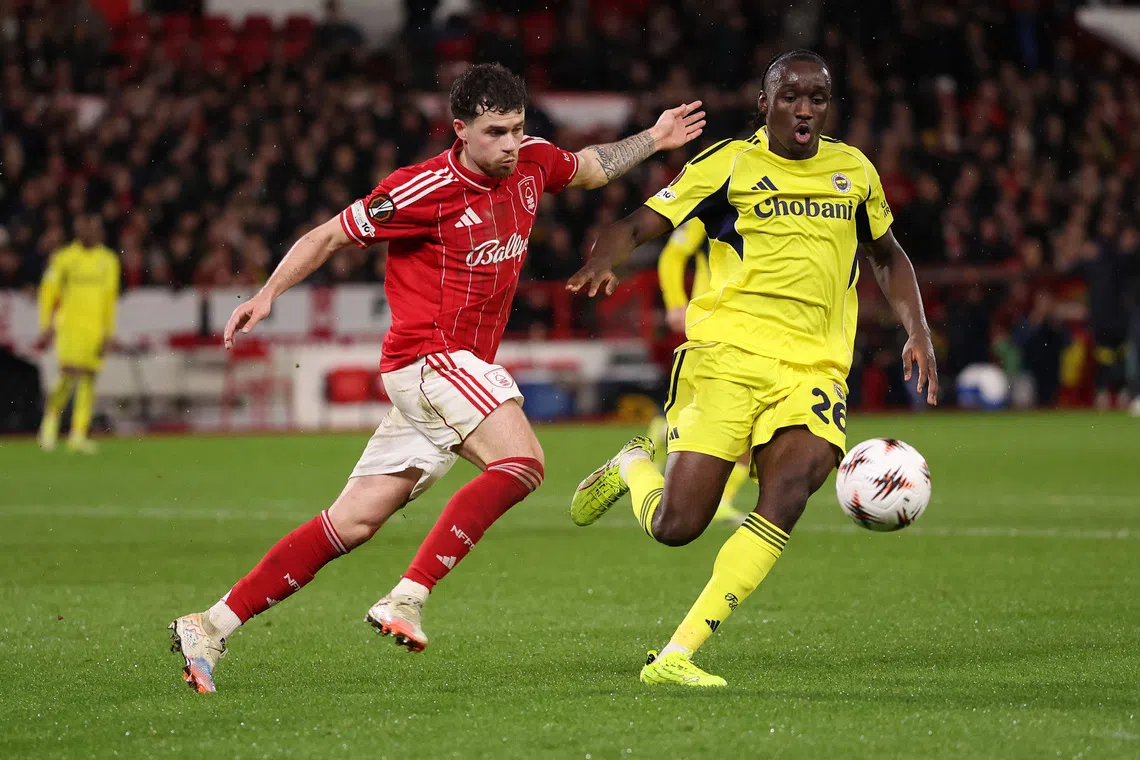 Soccer Football - UEFA Europa League - Play Off - Second Leg - Nottingham Forest v Fenerbahce - The City Ground, Nottingham, Britain - February 26, 2026 Nottingham Forest's Neco Williams in action with Fenerbahce's Sidiki Cherif REUTERS/Chris Radburn