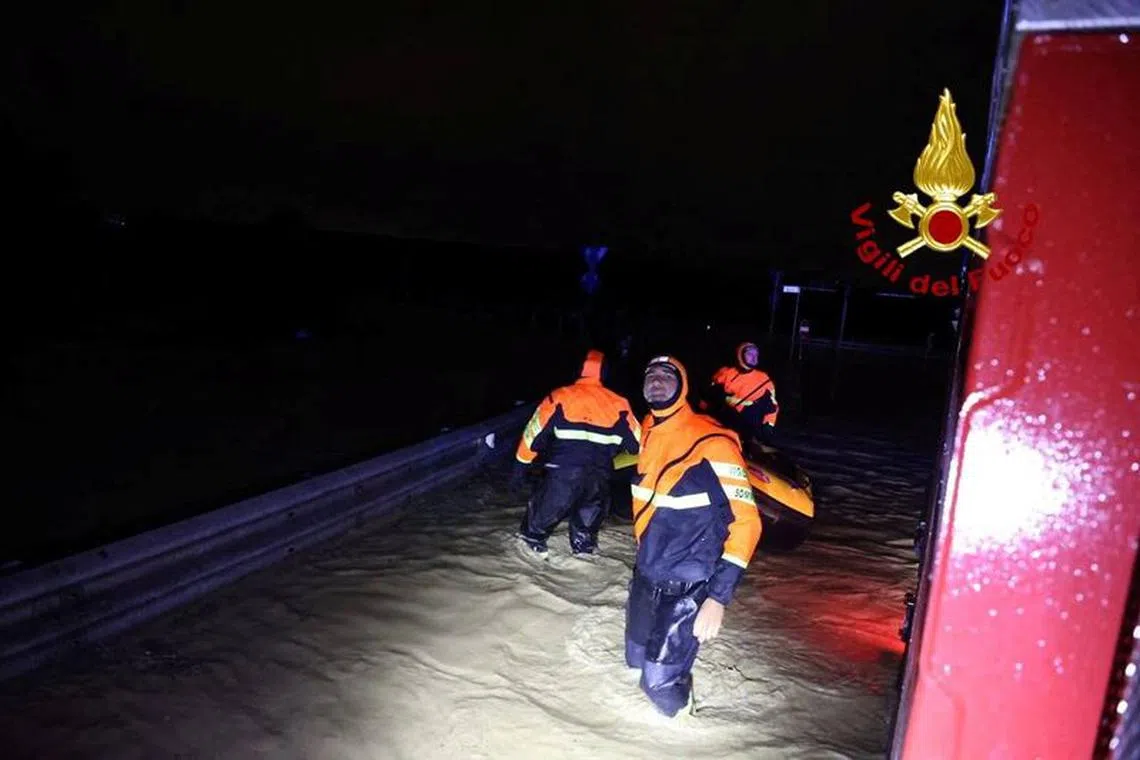 Italian firefighters work in flooded streets in the Tuscany region, Italy, November 3, 2023. Several people died and went missing central region of Tuscany as storm Ciaran battered western Europe. Vigili del Fuoco/Handout via REUTERS