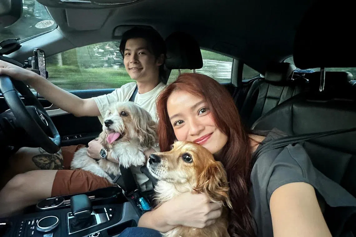 Local actress Xenia Tan (right) and her fiance, content creator Shawn Thia, and their dogs Aiko and Miyo.