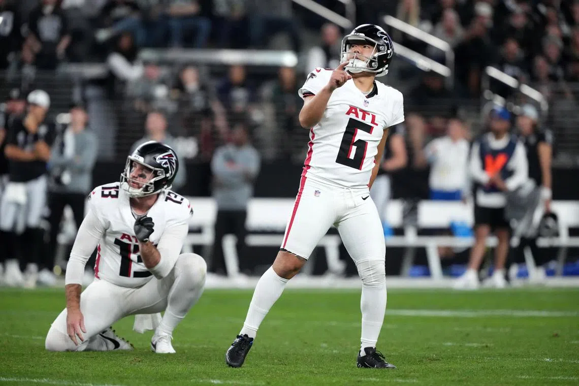 Dec 16, 2024; Paradise, Nevada, USA; Atlanta Falcons place kicker Younghoe Koo (6) kicks a field goal as Atlanta Falcons punter Bradley Pinion (13) holds during a game against the Las Vegas Raiders in the second half at Allegiant Stadium. Kirby Lee-Imagn Images/File Photo