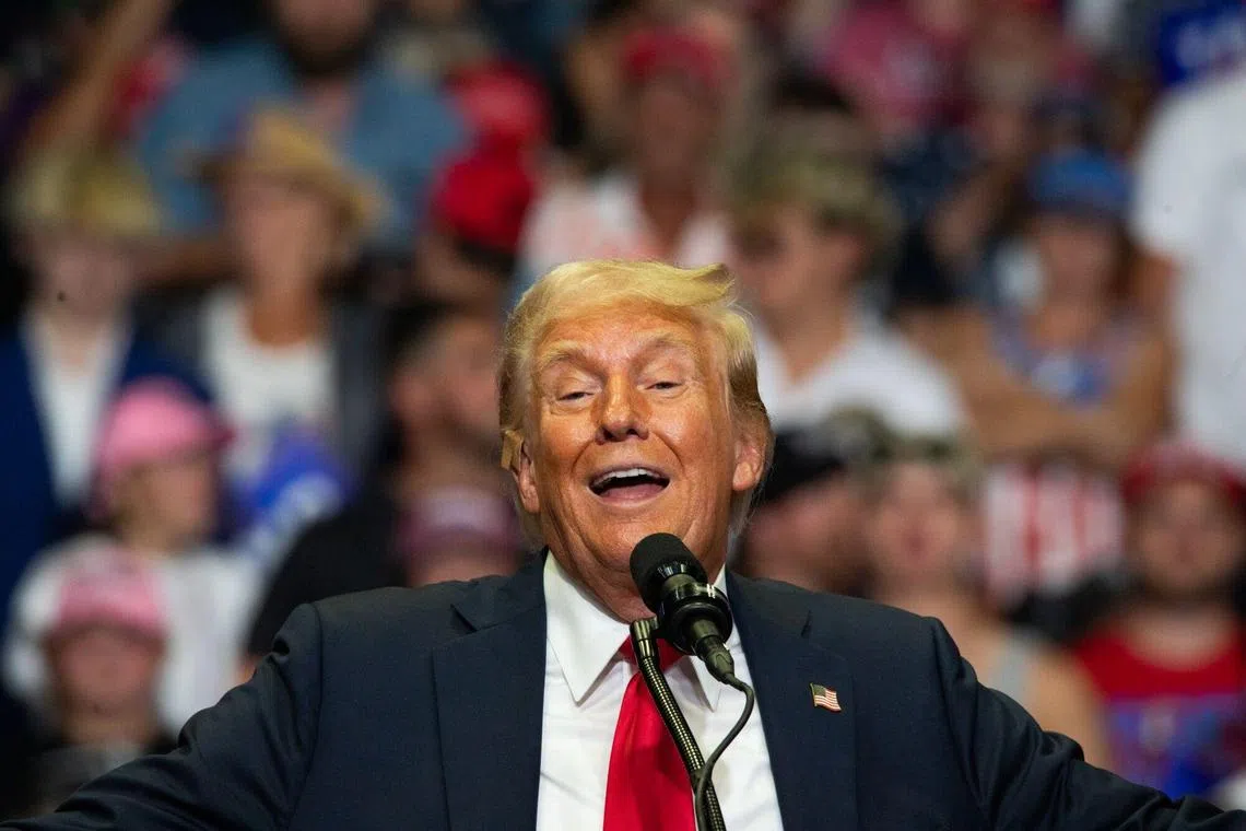Former US President Donald Trump speaks during a campaign event at Van Andel Arena in Grand Rapids, Michigan, US, on Saturday, July 20, 2024. Trump and running mate JD Vance are making their campaign-trail debut as the official Republican ticket by returning to one of a trio of key "blue wall" states that's increasingly likely to decide the US election. Photographer: Emily Elconin/Bloomberg