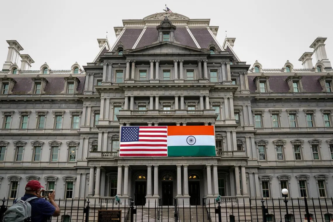 FILE PHOTO: The flags of the United States and India are displayed on the Eisenhower Executive Office Building at the White House in Washington, U.S., June 21, 2023. REUTERS/Elizabeth Frantz/File Photo