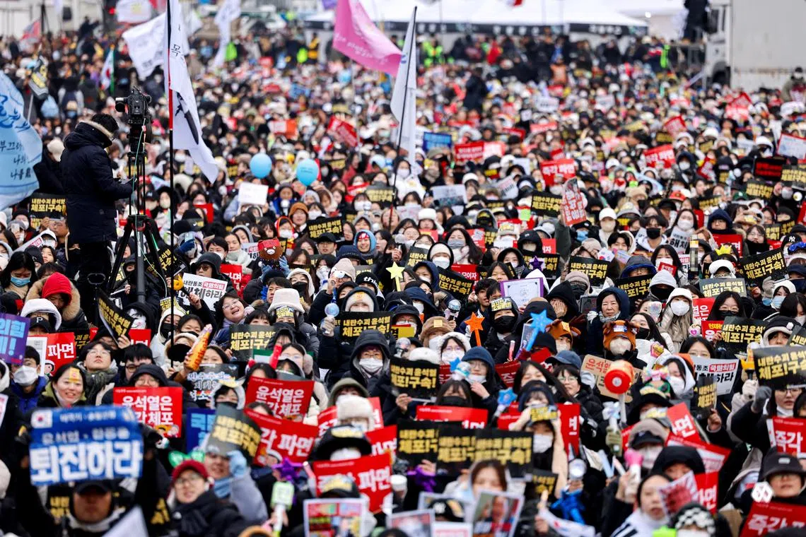 Protesters attend a rally against South Korea's impeached President Yoon Suk Yeol, who declared martial law, which was reversed hours later, in Seoul, South Korea, December 21, 2024. REUTERS/Kim Soo-hyeon