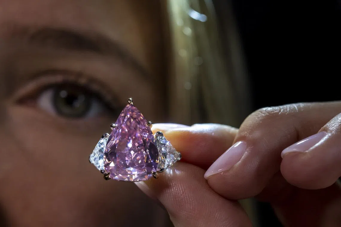 The 18.18-carat fancy vivid pink brilliant-cut diamond called 'Fortune Pink' was sold for $34.8 million at a Christie's auction in Geneva.