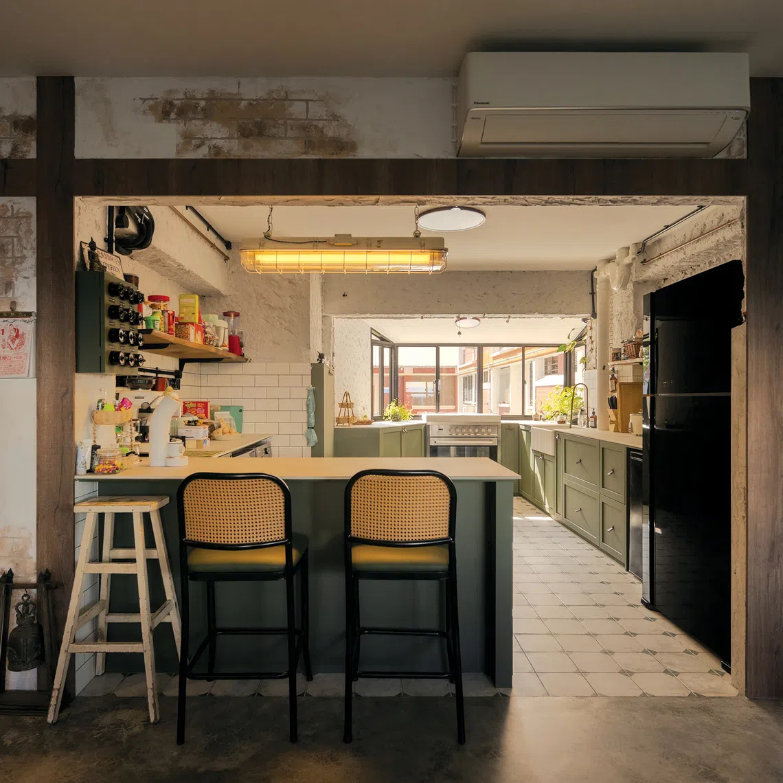 Raw textures and vintage decor create a rustic industrial look in this family's HDB flat.