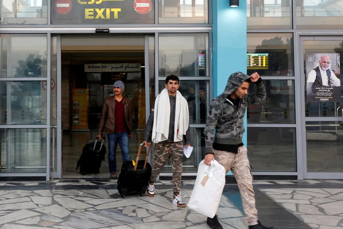FILE PHOTO: Afghans, whose asylum applications have been rejected, arrive from Germany in Kabul airport, Afghanistan December 15, 2016. REUTERS/Omar Sobhani//File Photo