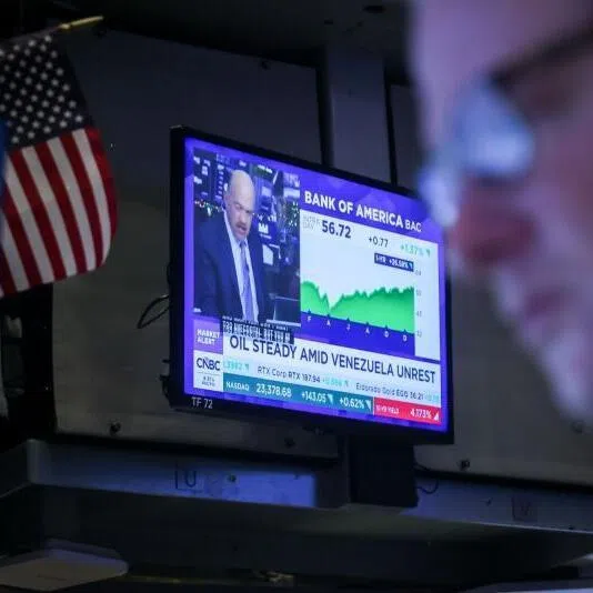A TV station broadcasts Venezuela news on the floor of the New York Stock Exchange in New York, on Jan 5.