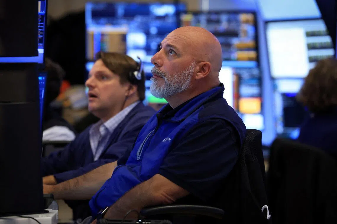 Traders working on the floor of the New York Stock Exchange, in New York City, on Aug 24.