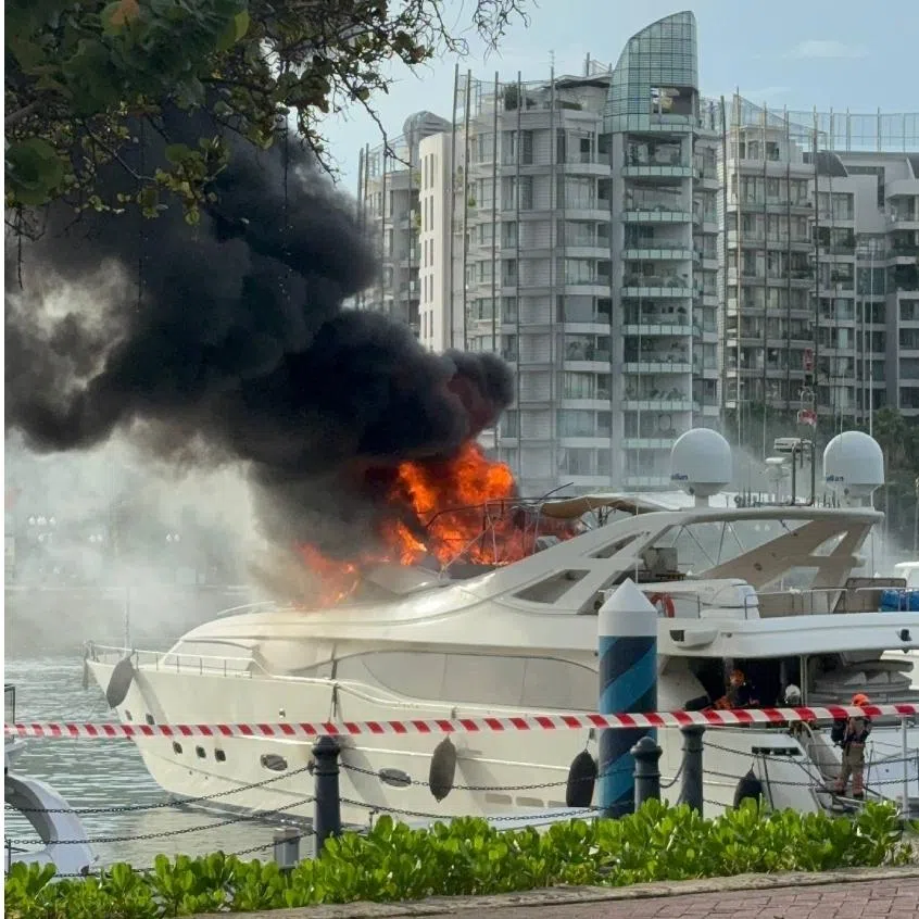 Thick black smoke could be seen billowing from the vessel berthed at the dock at the club.