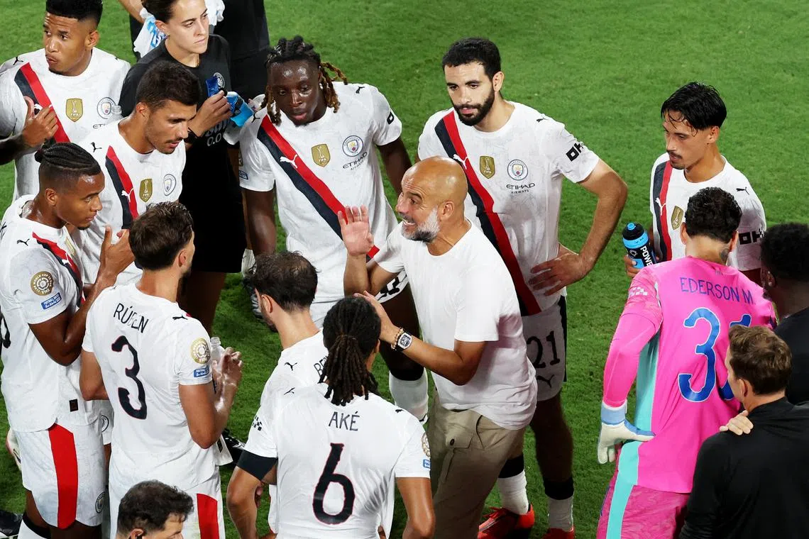FILE PHOTO: Soccer Football - FIFA Club World Cup - Round of 16 - Manchester City v Al Hilal - Camping World Stadium, Orlando, Florida, U.S. - June 30, 2025 Manchester City manager Pep Guardiola talks to his players before the start of extra time REUTERS/Hannah Mckay/File Photo