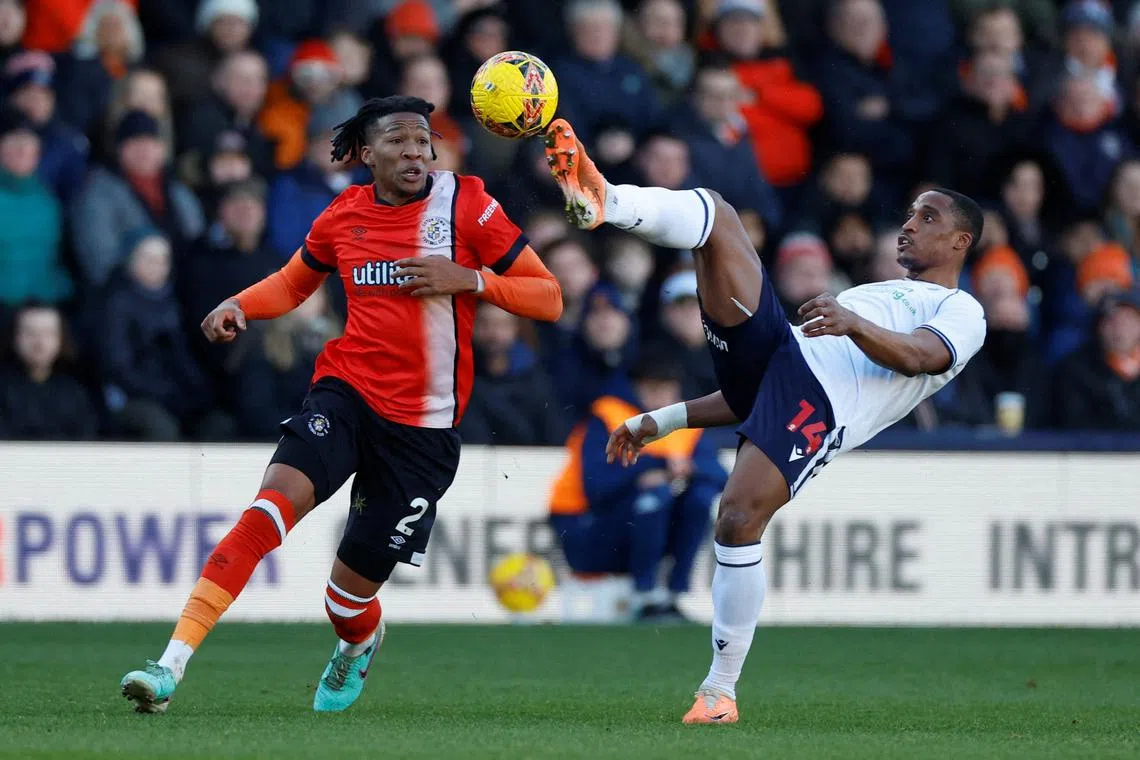 FILE PHOTO: Soccer Football - FA Cup - Third Round - Luton Town v Bolton Wanderers - Kenilworth Road, Luton, Britain - January 7, 2024 Bolton Wanderers' Victor Adeboyejo  in action with Luton Town's Gabriel Osho Action Images via Reuters/Peter Cziborra/File Photo