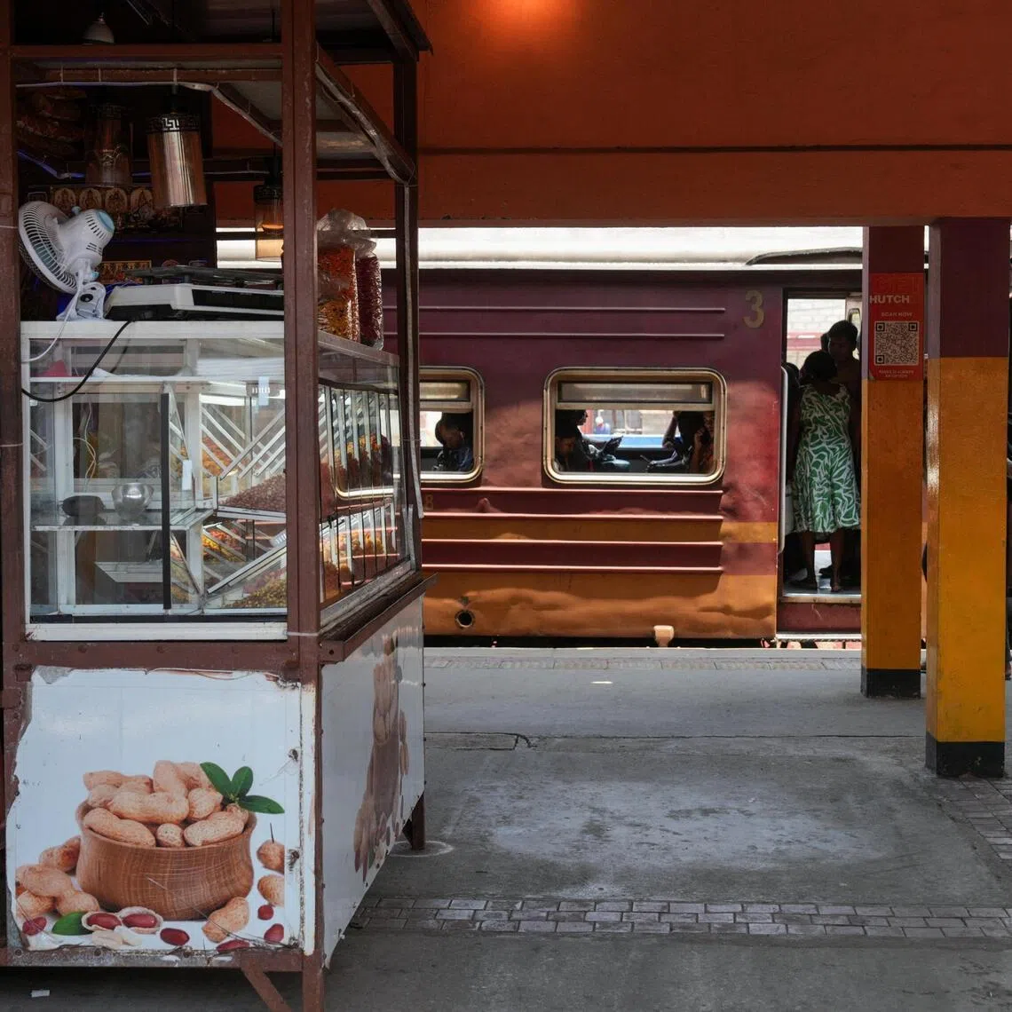 A vendor sitting in his shop at a railway station, after the Sri Lankan government declared a weekly Wednesday holiday for public officials to conserve fuel.