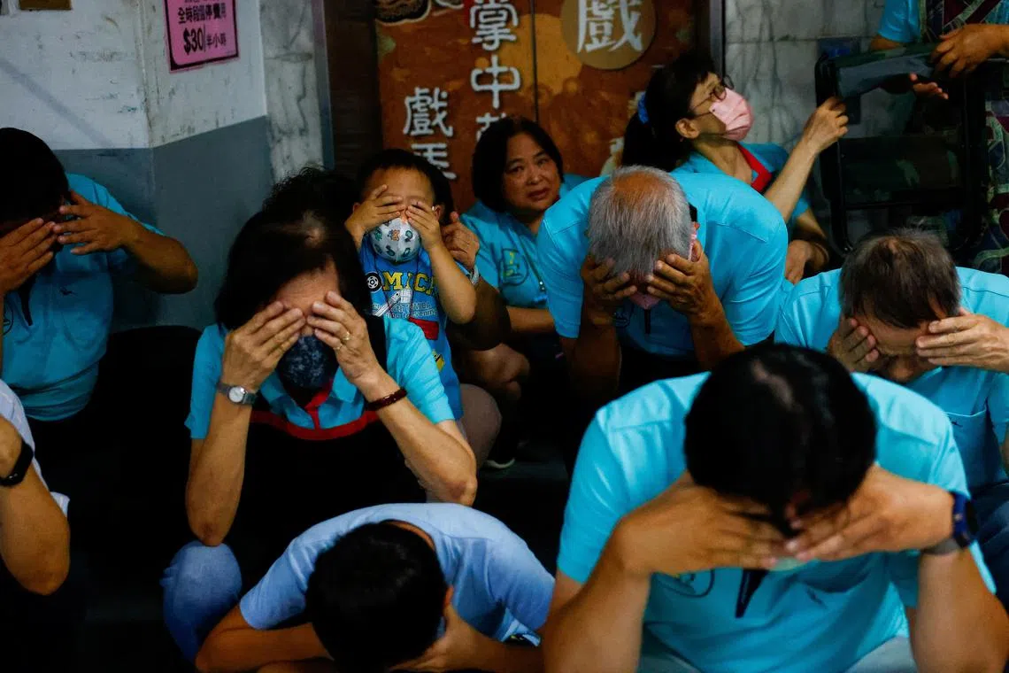 People participate in the annual air-raid exercise, where people are ordered to stay indoors for 30 minutes in Taipei, Taiwan July 23, 2024. REUTERS/Ann Wang