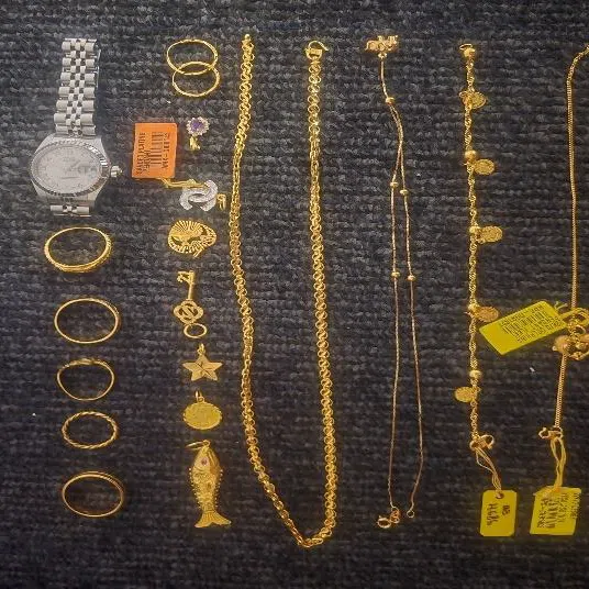 An assortment of valuables and jewelleries recovered involving the 54-year-old scam victim.